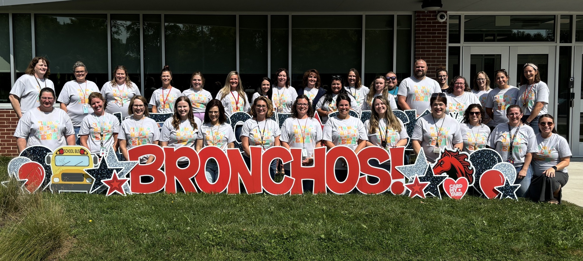 Holly Elementary Staff group photo in front of the building