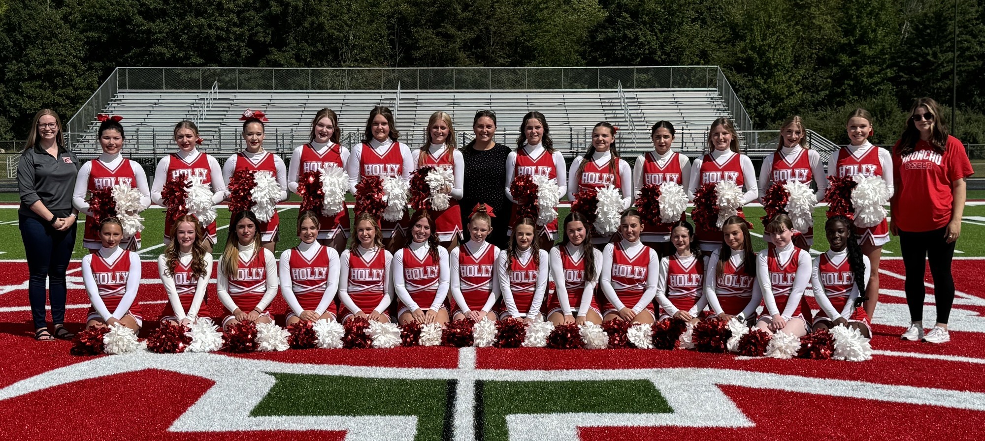 Varsity Cheer team on the new turf