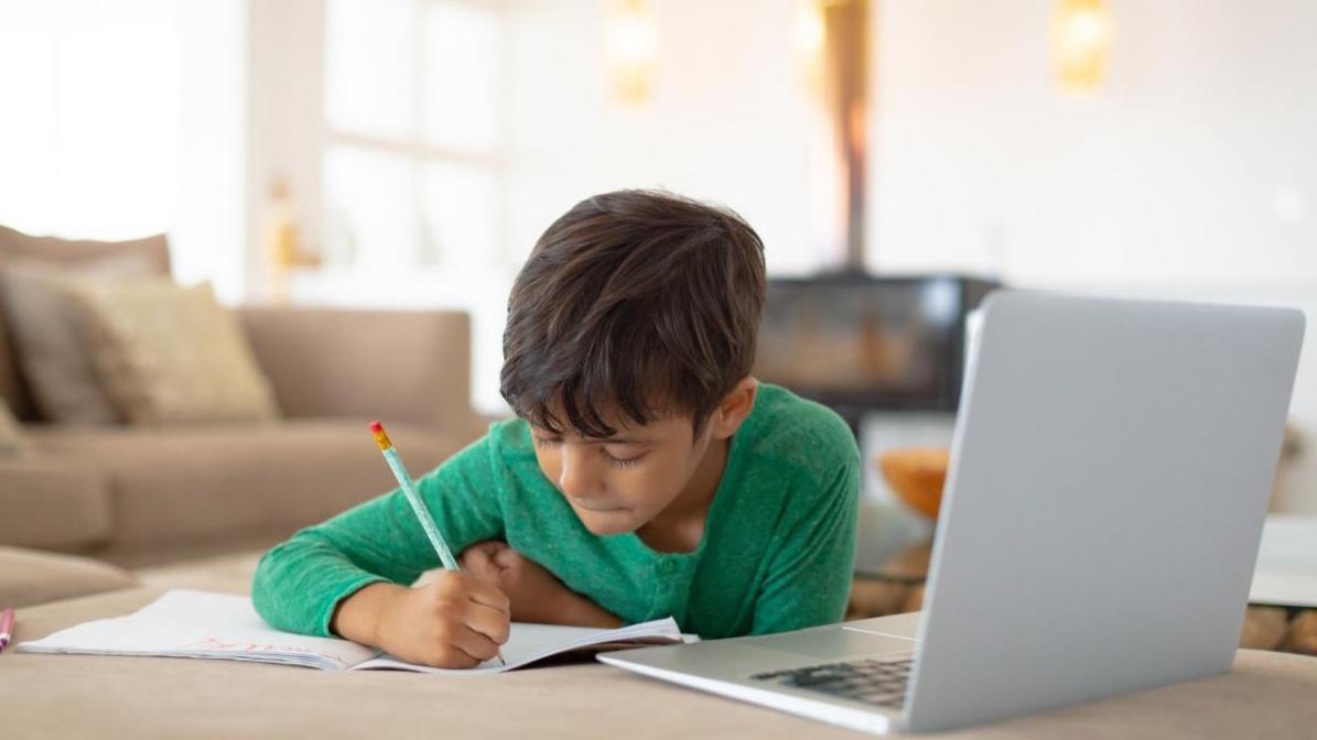 student on a computer at home