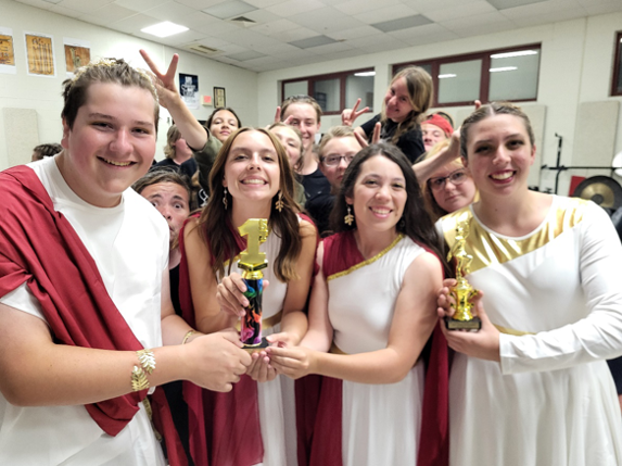 Students holding trophies